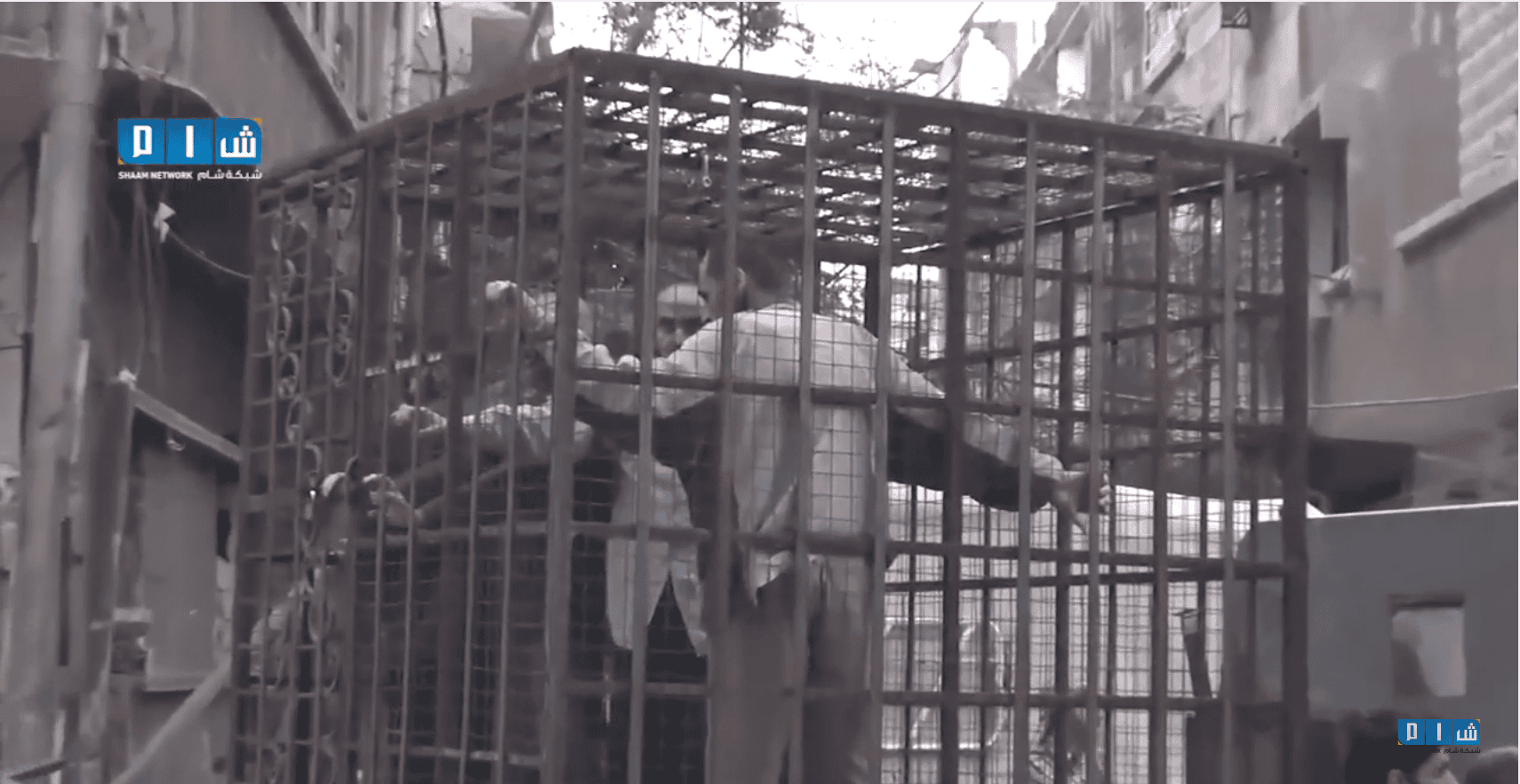 Syrian rebels use caged civilians, fighters to deter airstrikes