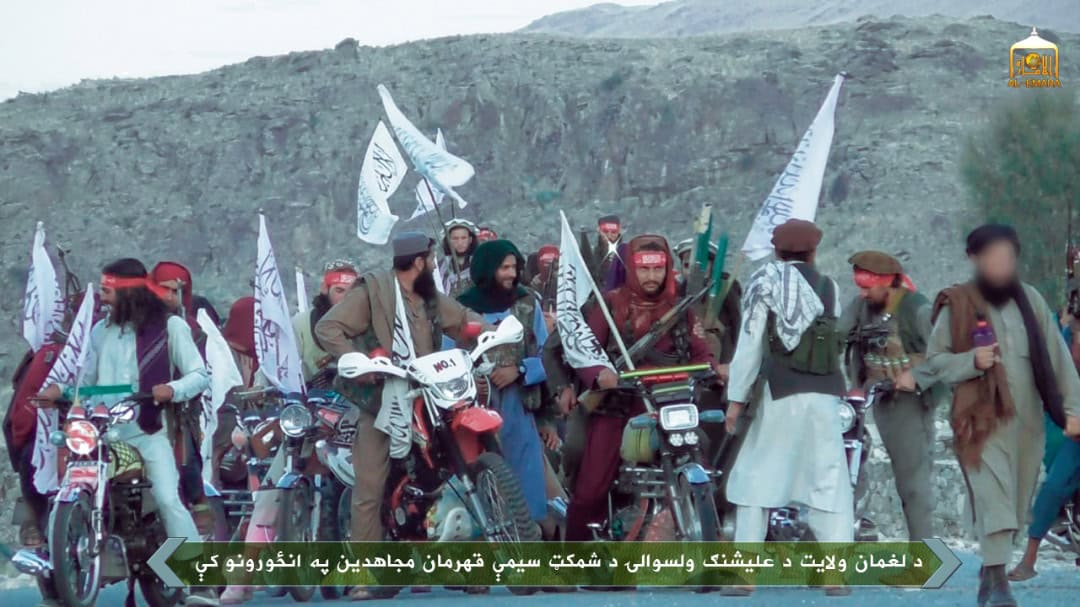 Taliban parades fighters as 400 more prisoners are freed