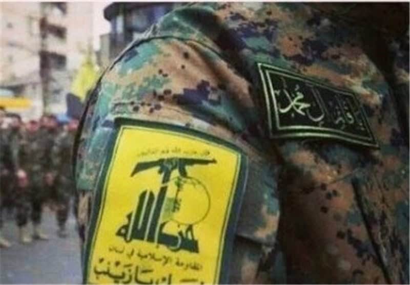 Fighter bearing Lebanese Hezbollah's insignia