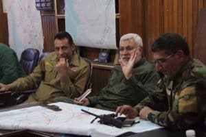 Middle, Abu Mehdi al Muhandis, PMF Commander and deputy to IRGC-QF chief Qassem Soleimani, and, left, Hakim al Zamili, head of the parliament national security committee who ran sectarian deathsquads ten years ago